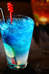 Blue cocktail with  lemon