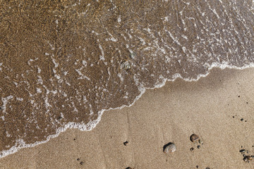 Close up of sea wave on a beach