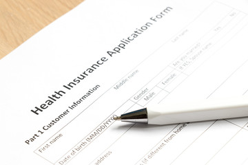 Health insurance application form wait to fill information on desk background