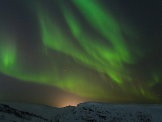 Fototapeta na wymiar Night,winter, landscape, hills,tundra, and in the sky the stars, Aurora.