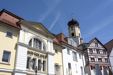 Fototapeta premium Germany, Sigmaringen, upper Danube: Steeple of old parish church St. John and Court Theater (Hoftheater) over the ancient city and blue sky in the background.