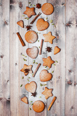 Traditional ginger cookies and spices on the wooden table