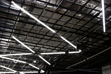 Fluorescent lamps on the hi-tech ceiling - included daytime lamps - bright light