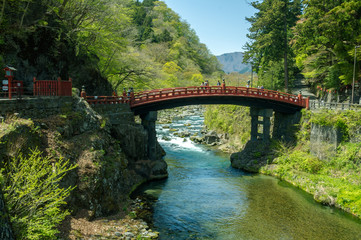 Japan traditional wooden arch bridge over river
