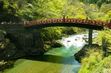 Fototapeta na wymiar Japan traditional wooden arch bridge over river