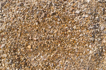 Small pebbles and sand as a background, texture