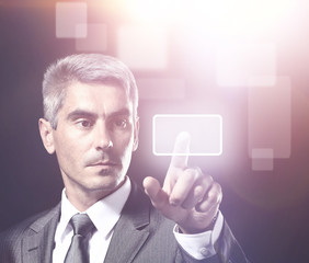 business man pressing a virtual button