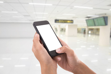 hand holding smart phone screen isolated with blurred abstract hallway background.