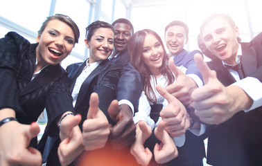 Portrait of excited young business people pointing at you