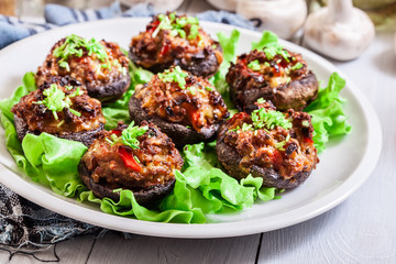 Baked champignon caps stuffed with minced meat