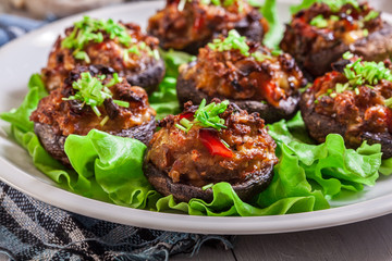 Baked champignon caps stuffed with minced meat