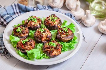 Baked champignon caps stuffed with minced meat