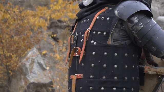 Warrior pierces the enemy with a halberd in battle
