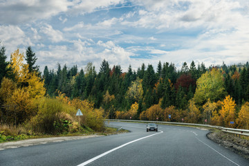 Car on highway curve