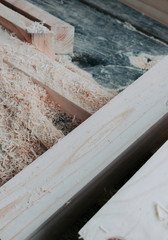 Stack of Building Lumber with sawdust at Construction Site