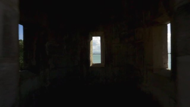 POV shot walking owards inside of garita in Old San Juan and then see ocean