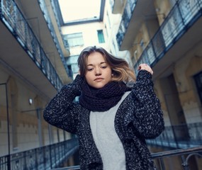 Portrait of young woman in knitwear