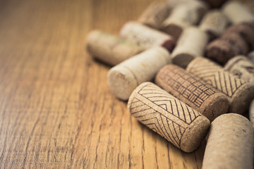 Bunch of wine corks on wooden table