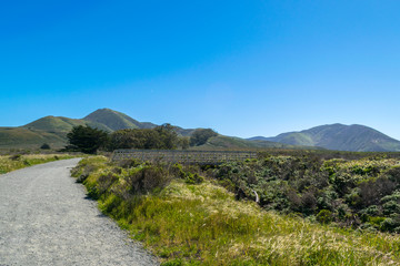 Exploring the Pacific shoreline at Spooner's Cove, Bluff Trail, Montana de Oro State Park, Morro Bay, San Luis Obispo County, California, USA