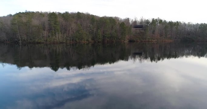 Aerial drone footage over a lake in the mountains