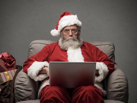 Santa Claus connecting with a laptop