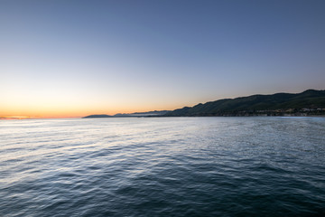 Waiting for the Sun to set at Pismo Beach, Oceano Dunes Natural Preserve, California, USA