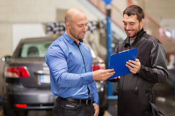 auto mechanic and customer at car shop