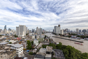 Boats on the Chao Phraya river in Bangkok, Thailand.