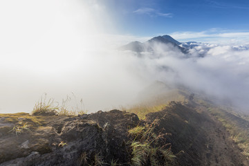 A beautiful misty trail on the steep edge of the caldera on Mount Batur on Bali, Indonesia.