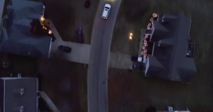 Aerial drone detective tracking of a car on a dark night