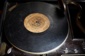 Ancient gramophone with a plate in the museum of antiques