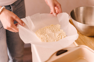 Process of making macaroon, french dessert. Homemade food, woman's hands unpack butter