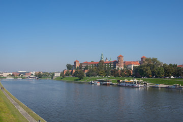 Fototapeta na wymiar Krakow, Poland 01/10/2017 People walking by the Vistula River with a Panoramic View