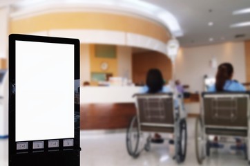 mock up of vertical advertising billboard or blank showcase light box for your text message or media content with patient in wheelchair at hospital, commercial, marketing and advertisement concept