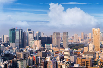 Fototapeta premium Aerial skyscraper view of office building and downtown and cityscapes of Tokyo city with blue sly and clouds background. Japan, Asia