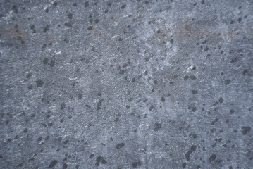 Rain drops on blue grey concrete surface