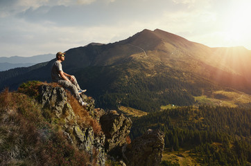 hiker on peak mountain