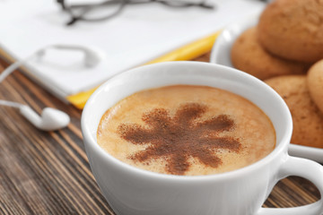 Cup of aromatic morning coffee on wooden table