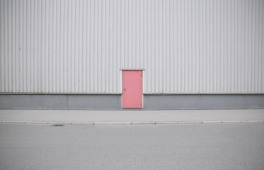 Gray building with red door
