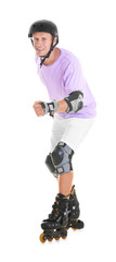 Young man on roller skates against white background