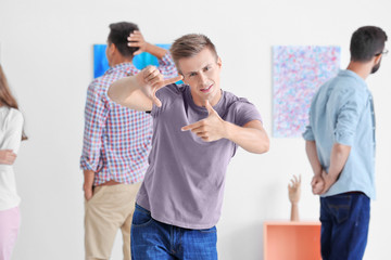 Young man in art gallery