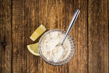 Portion of fresh Lemon powder (selective focus; close-up shot)