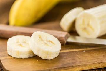 Portion of Sliced Bananas on wooden background, selective focus