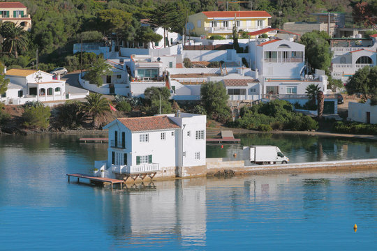 Country houses on coast of sea gulf. Mahon, Minorca, Spain