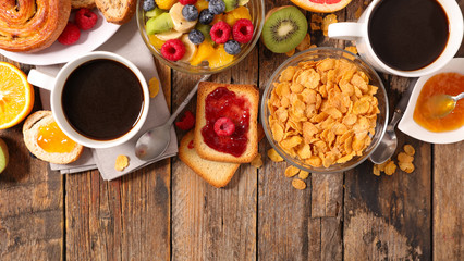 breakfast with coffee, fruit,cereal and croissant