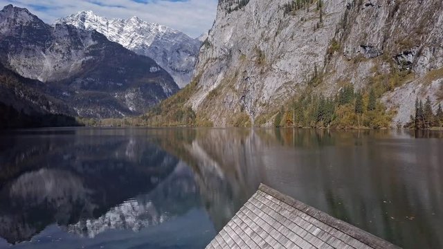 Flight over calm Obersee Lake in the Berchtesgaden National Park, Bavaria, Germany.