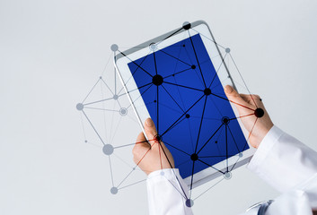 Close of female doctor hands working with tablet pc computer