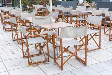 Several wooden linen chairs from a cafe