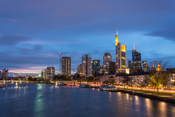 Fototapeta na wymiar The skyline of Frankfurt with the river Main during blue hour