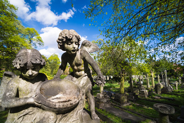 Angel child statues in Brompton Cemetery, London.